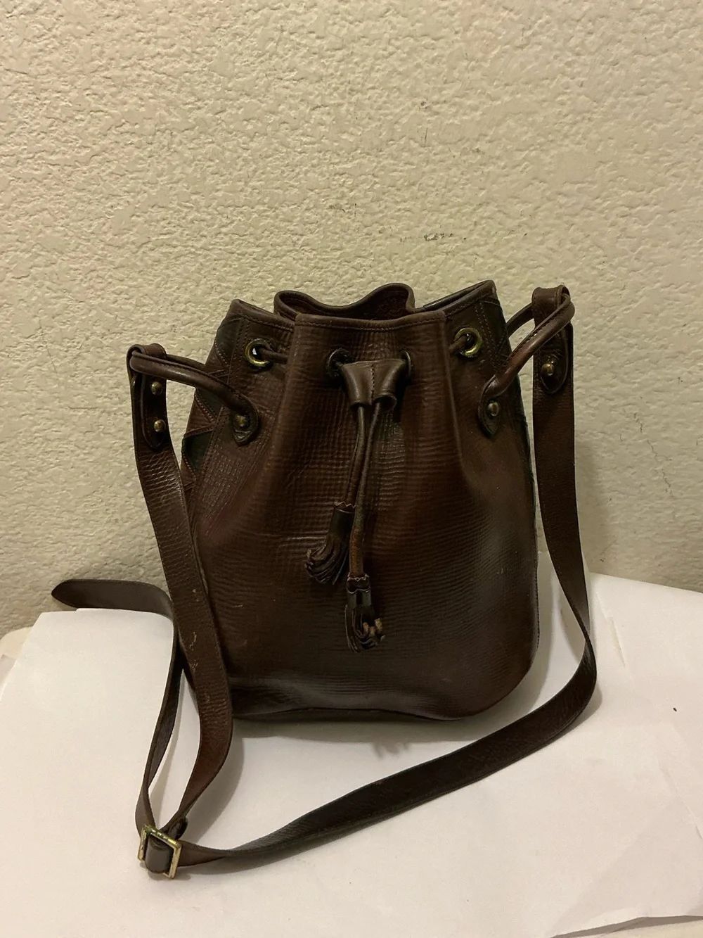 Dooney & Bourke Dark Brown Aztec Teton Leather Drawstring Bucket Crossbody